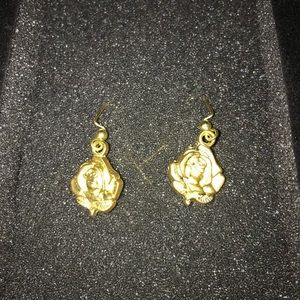 Yellow gold tone rose earrings.
